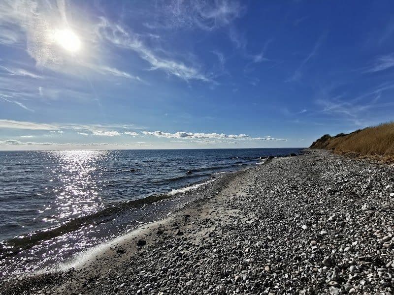 Relax at Vesterstrand Beach with its iconic beach huts and scenic views