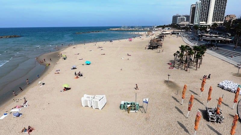 Relax and sunbathe at Gordon Beach