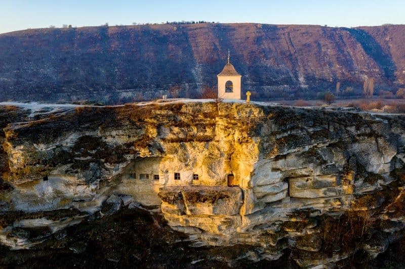 Visit the Cave Monastery carved into the cliffs